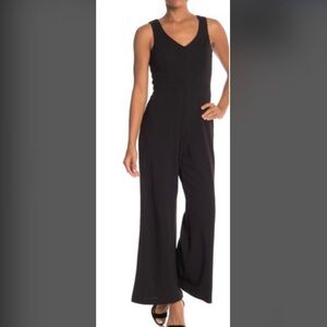 Feminine, Sexy Navy Blue Jumpsuit by Marina. Polyester-spandex, NWT